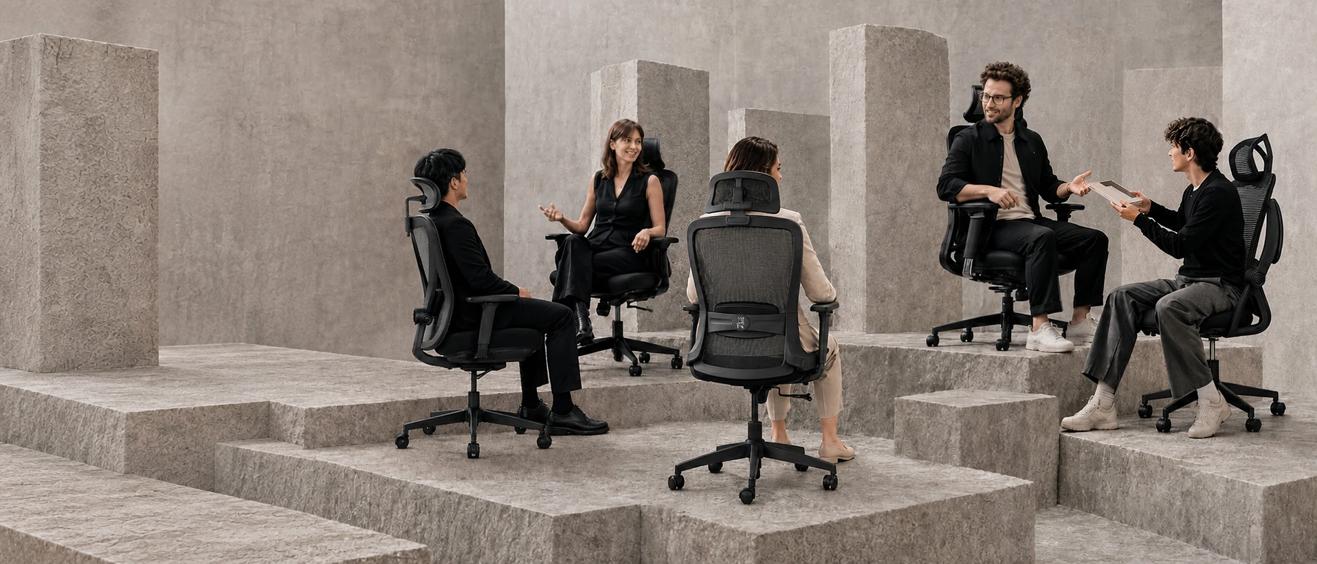 People seated in ergonomic chairs within a premium architectural workspace